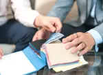 hands holding fabric samples